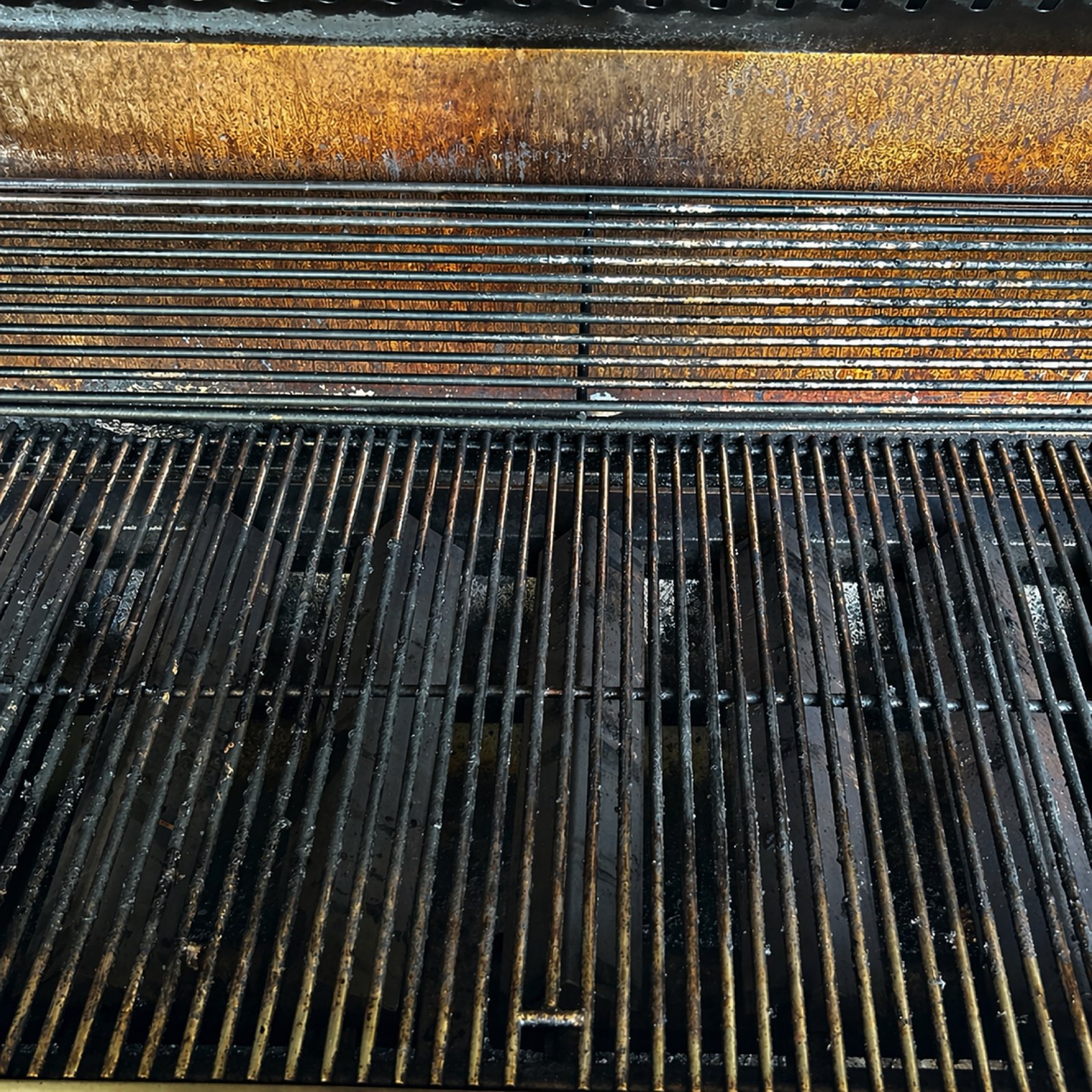 Grates caked in baked-on grease before service